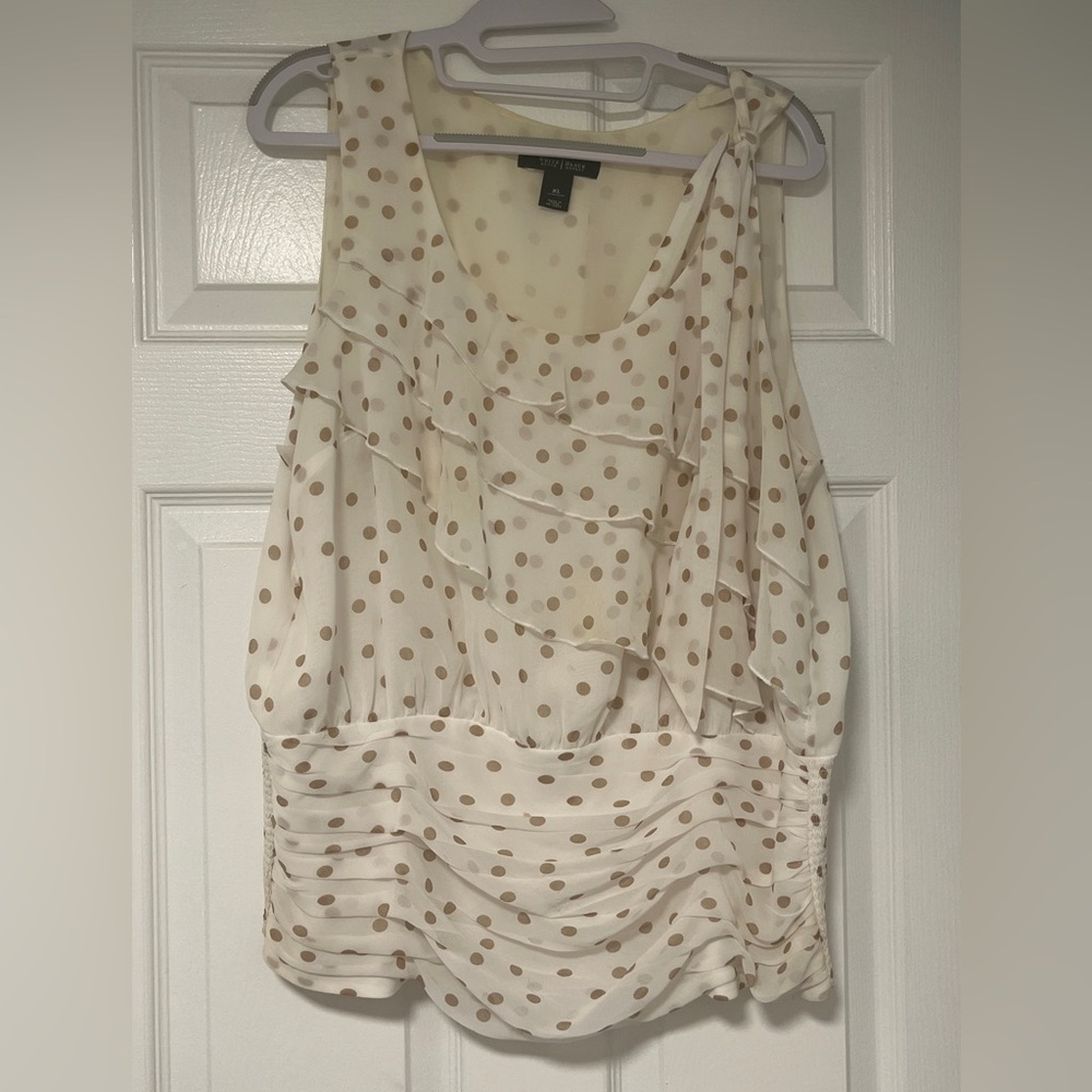 Cute cream colored top with tan dots, flounces and elastic bottom